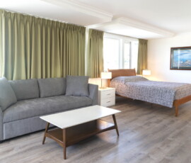 Seal Rock Inn - Room 104 - Bed and sofa