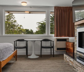 Seal Rock Inn - Room 305 - Tables and Fireplace
